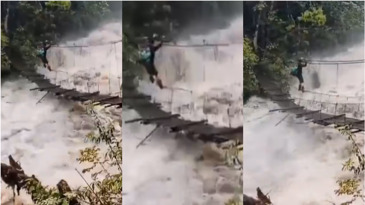 ആർത്തലക്കുന്ന പുഴ, ആടിയുലയുന്ന തൂക്കുപാലം, കയറിൽ തൂങ്ങി യുവാവിന്റെ സാഹസികത വീഡിയോ