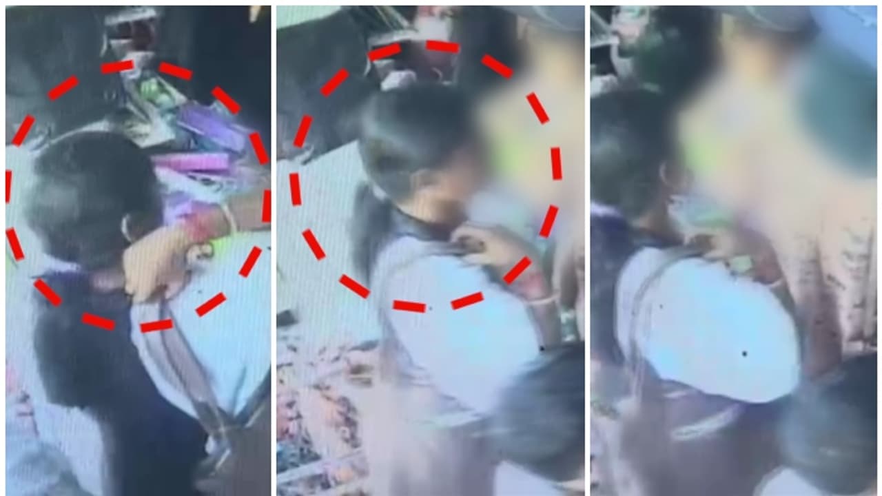 പിറകിൽ നിന്ന് മാറാതെ യുവതി, അമ്മയ്ക്കൊപ്പം സാധനം വാങ്ങാനെത്തിയ കൈ കുഞ്ഞിന്റെ സ്വർണമാല കവർന്നു, സിസിടിവി വീഡിയോ