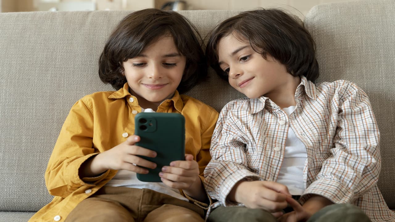 A child using tablet safely under parental guidance A child using tablet safely under parental guidance