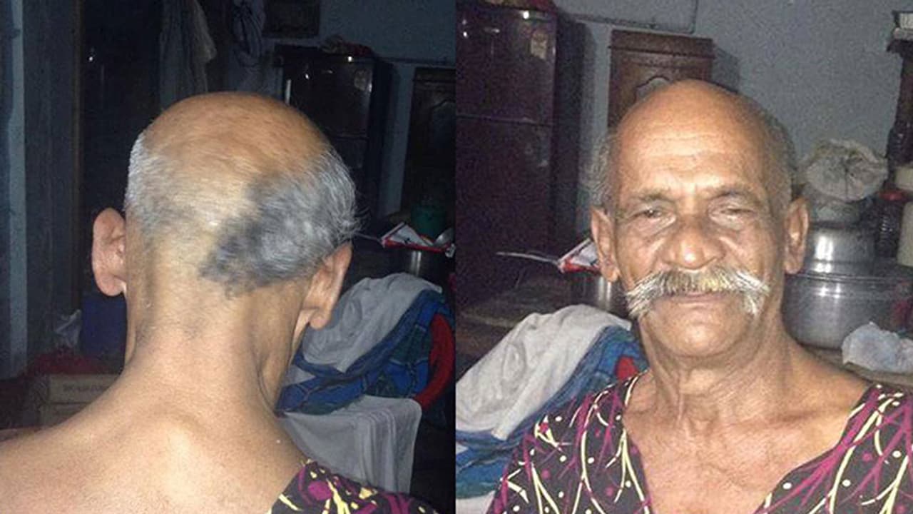 Kerala chaiwalla burns ₹ 23,000, vows to keep half shaven head till Modi quits Kerala chaiwalla burns ₹ 23,000, vows to keep half shaven head till Modi quits