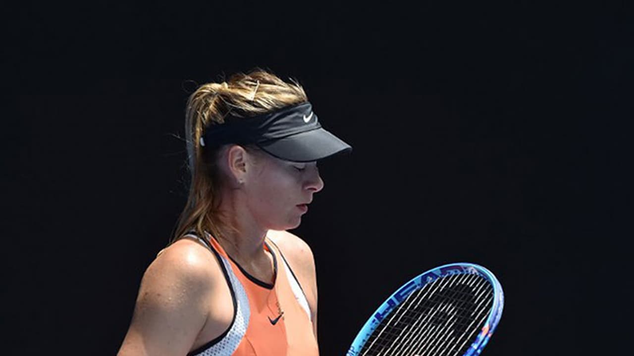 Sharapova's ban cut to 15 months; will return to action in April Sharapova's ban cut to 15 months; will return to action in April