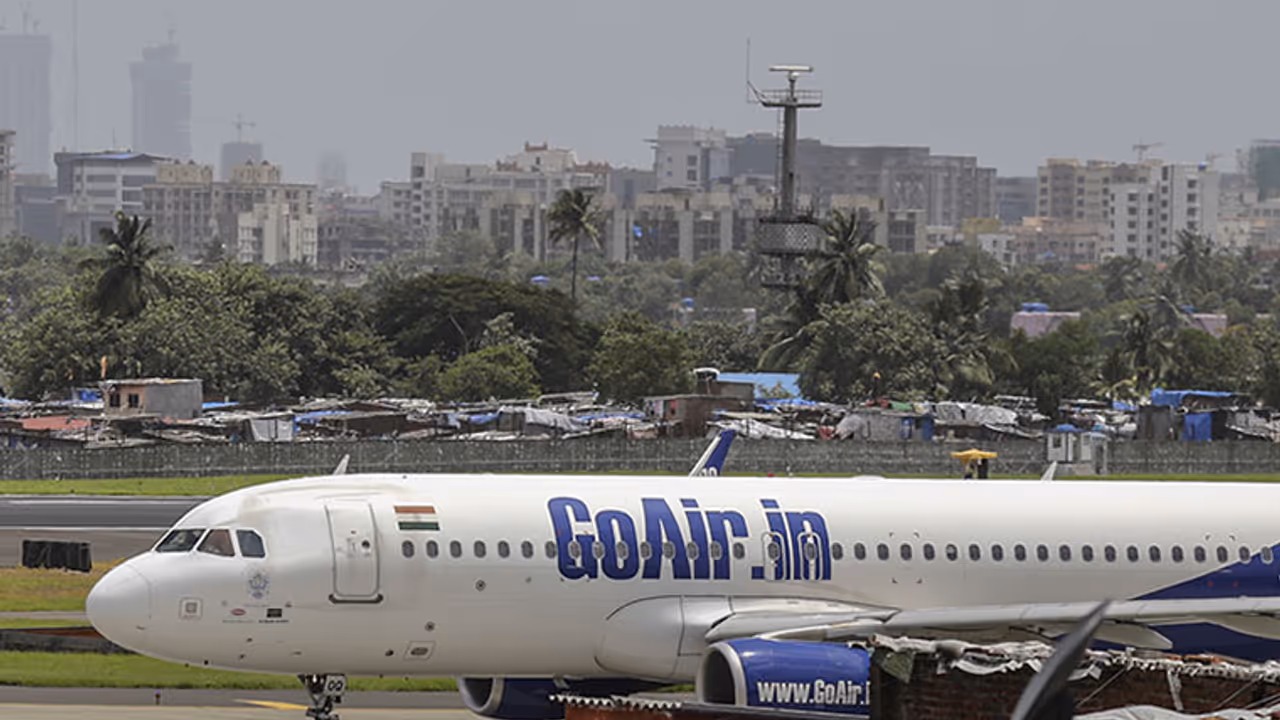 GoAir passenger opens aircraft’s emergency exit door in Bengaluru GoAir passenger opens aircraft’s emergency exit door in Bengaluru