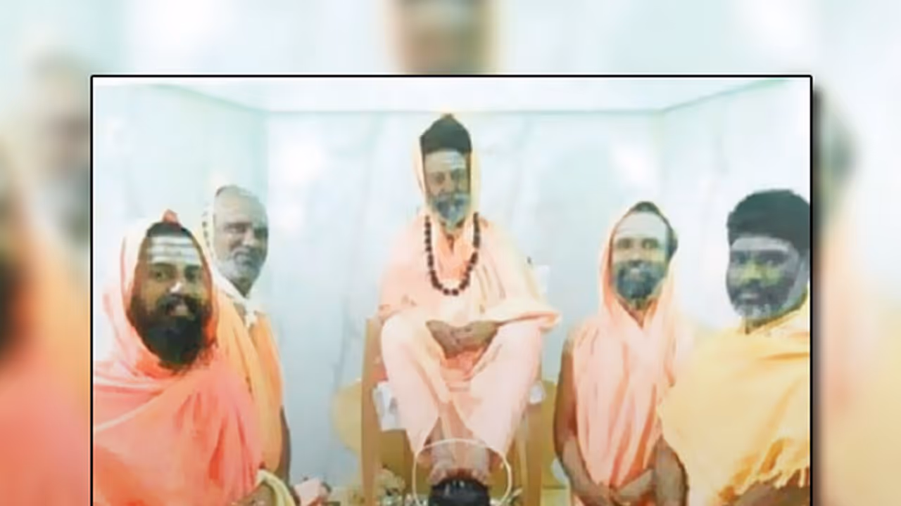 Seer places his feet on Linga, devotees fume with anger Seer places his feet on Linga, devotees fume with anger