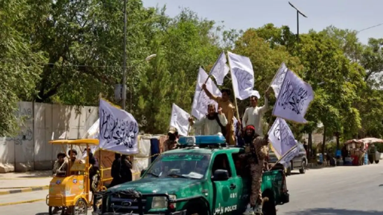 Members of the Taliban carrying flags participate in a rally to mark the third anniversary of the fall of Kabul, in Kabul, Afghanistan (File Image/Reuters)