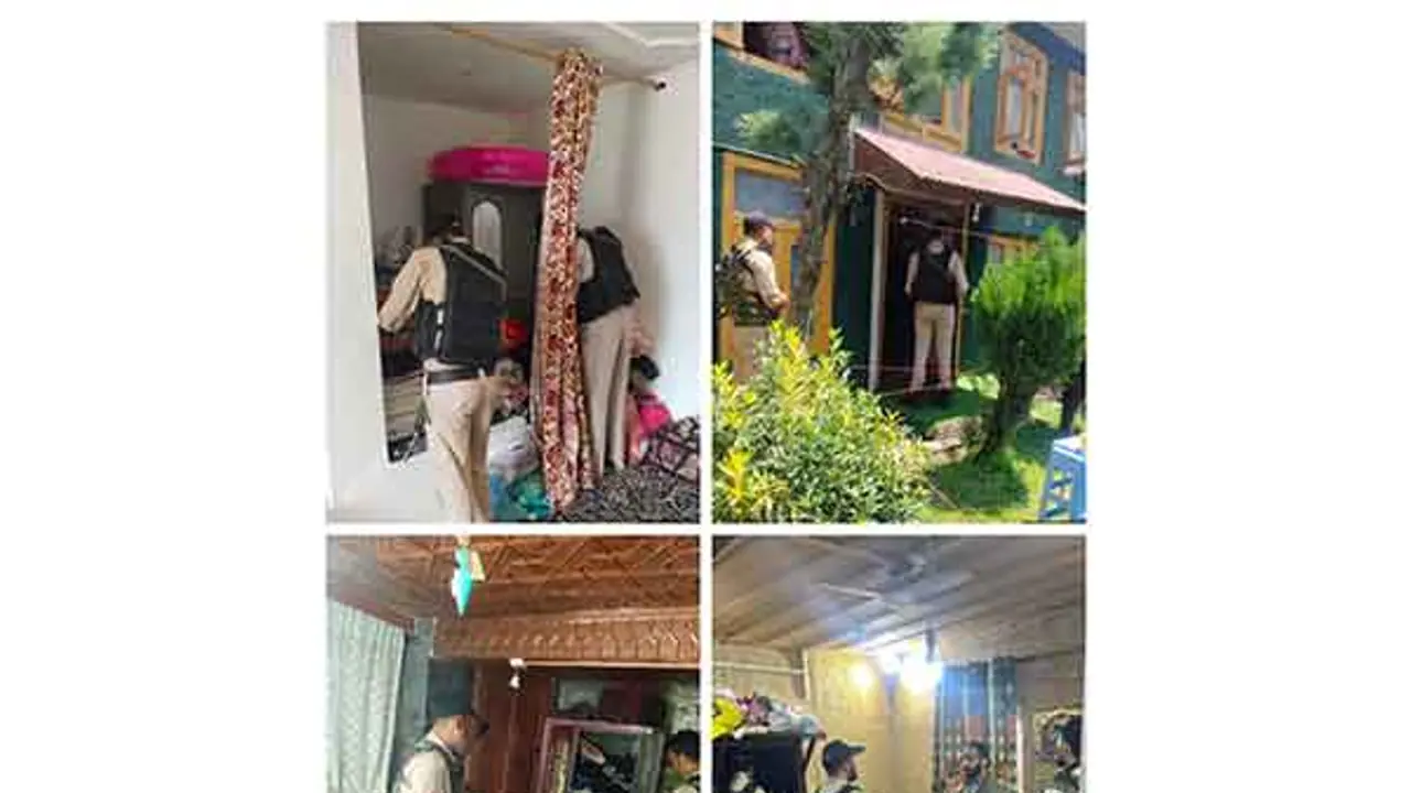 J K Police conducts searches at residences of 36 terrorist associates in Srinagar (Photo/ANI) J K Police conducts searches at residences of 36 terrorist associates in Srinagar (Photo/ANI)