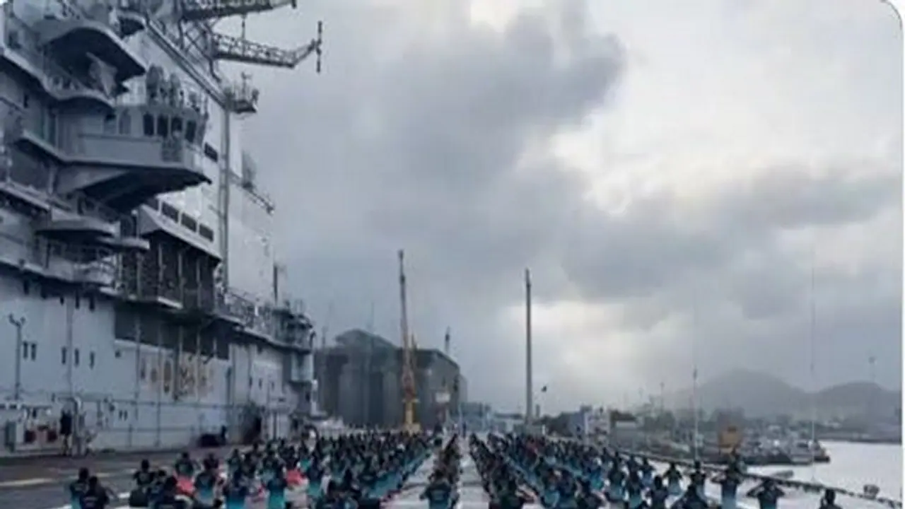Navy personnel performing various yoga asanas on the deck of INS Vikramaditya (Photo/ANI) Navy personnel performing various yoga asanas on the deck of INS Vikramaditya (Photo/ANI)