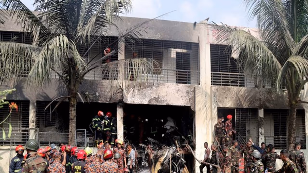Firefighters and soldiers work next to the wreckage of an air force training aircraft after it crashed into Milestone College campus, in Dhaka (Image/Reuters) Firefighters and soldiers work next to the wreckage of an air force training aircraft after it crashed into Milestone College campus, in Dhaka (Image/Reuters)