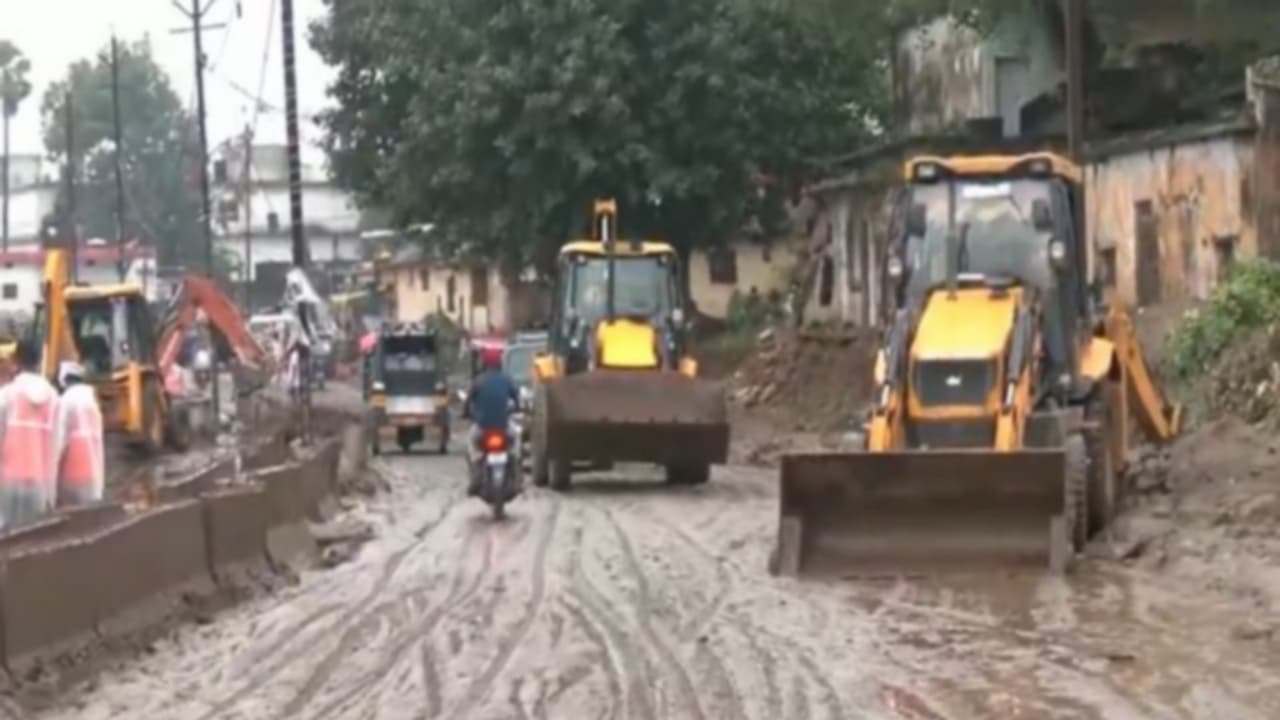 Road cleaning drive underway in flood hit Chitrakoot as JCBs clear mud and debris (Photo/ANI) Road cleaning drive underway in flood hit Chitrakoot as JCBs clear mud and debris (Photo/ANI)
