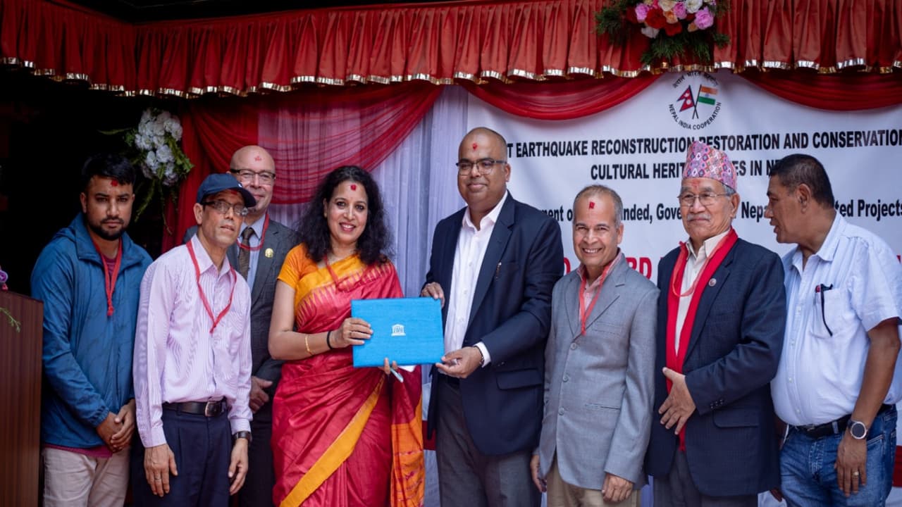 Officials present the UNESCO Asia Pacific Award of Merit certificate to the Jestha Varna Mahavihar User Committee during a ceremony in Lalitpur, Nepal. (Image Source: Indian Embassy in Kathmandu) Officials present the UNESCO Asia Pacific Award of Merit certificate to the Jestha Varna Mahavihar User Committee during a ceremony in Lalitpur, Nepal. (Image Source: Indian Embassy in Kathmandu)