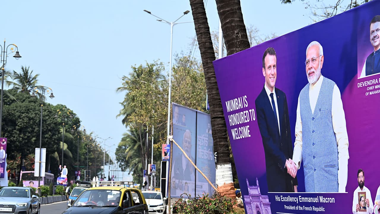 Posters Welcoming French President Emmanuel Macron to India (Photo/ANI) Posters Welcoming French President Emmanuel Macron to India (Photo/ANI)
