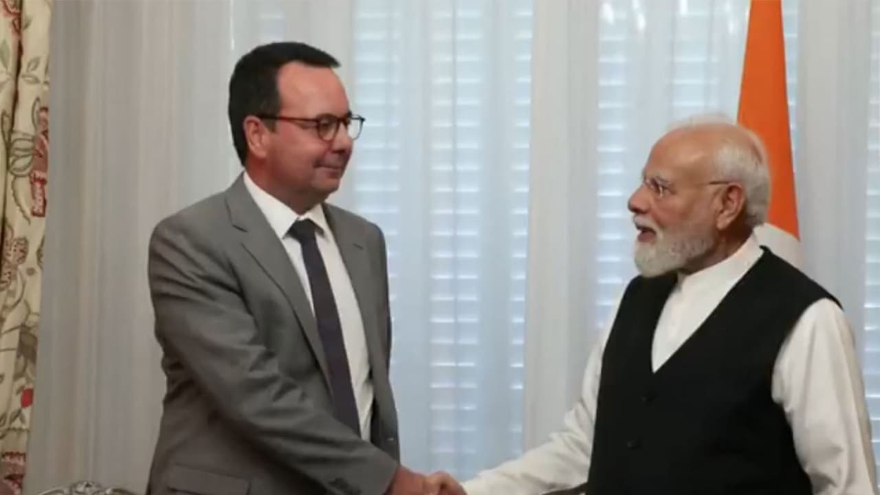 Prime Minister Narendra Modi meets Alstom CEO Martin Sion during his visit to Paris, France. (Photo/ANI) Prime Minister Narendra Modi meets Alstom CEO Martin Sion during his visit to Paris, France. (Photo/ANI)