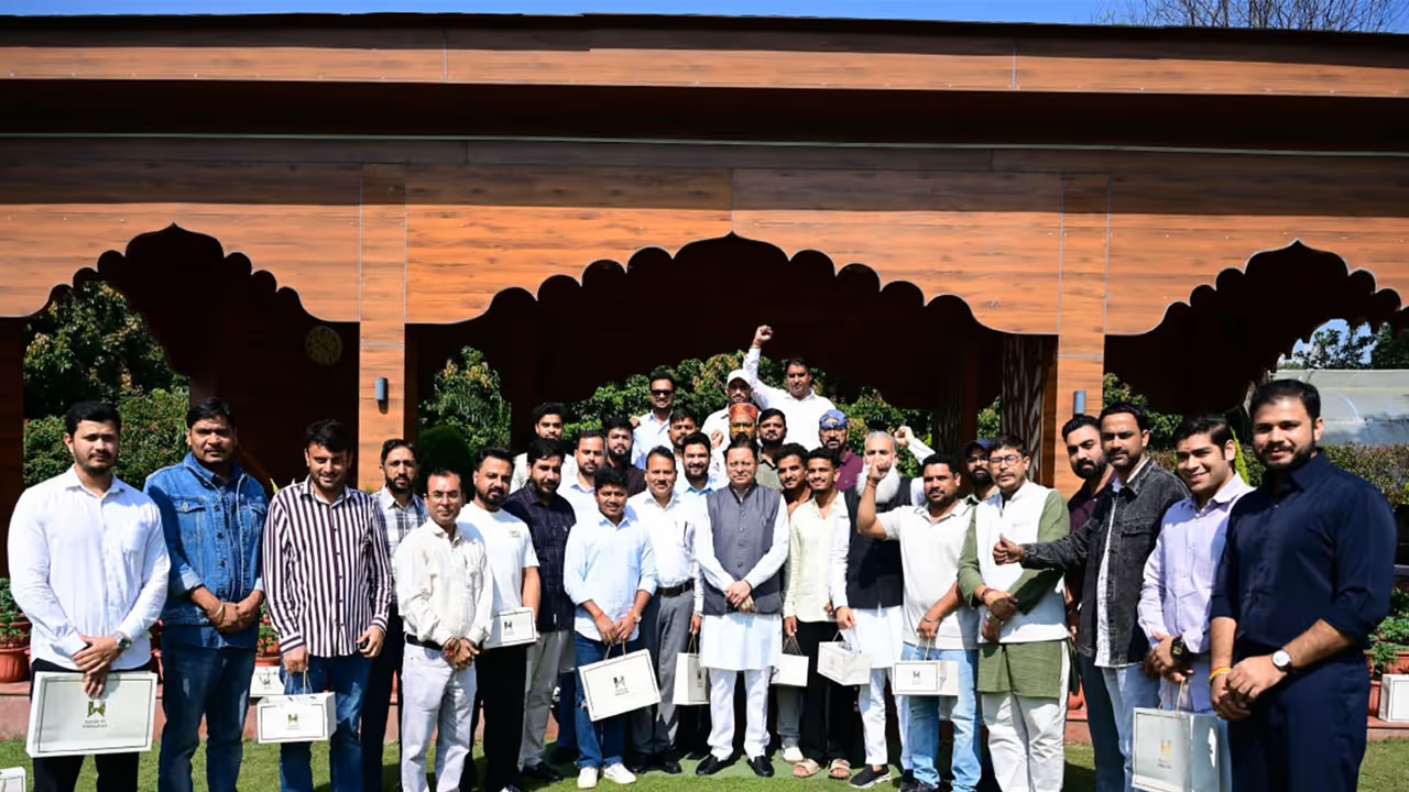 Uttarakhand Chief minsiter Pushkar Singh Dhami along with youths from Haryana (Photo/ANI) Uttarakhand Chief minsiter Pushkar Singh Dhami along with youths from Haryana (Photo/ANI)