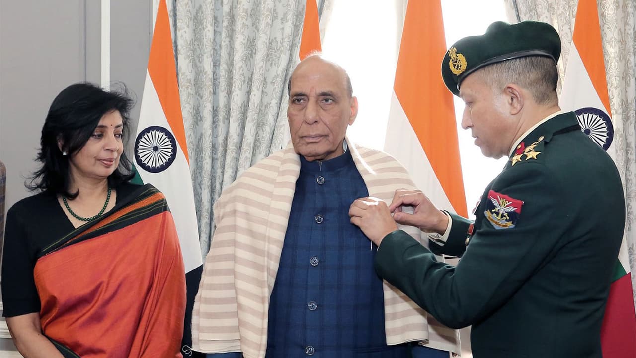 Defence Minister Rajnath Singh being pinned the Armed Forces Flag pin (Photo/X @rajnathsingh)
