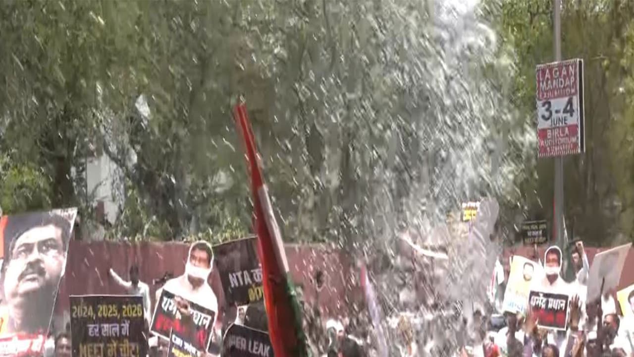 Jaipur: Police use water cannons to disperse Congress workers during protest march against NEET UG 2026 paper leak case (Photo/ANI) Jaipur: Police use water cannons to disperse Congress workers during protest march against NEET UG 2026 paper leak case (Photo/ANI)