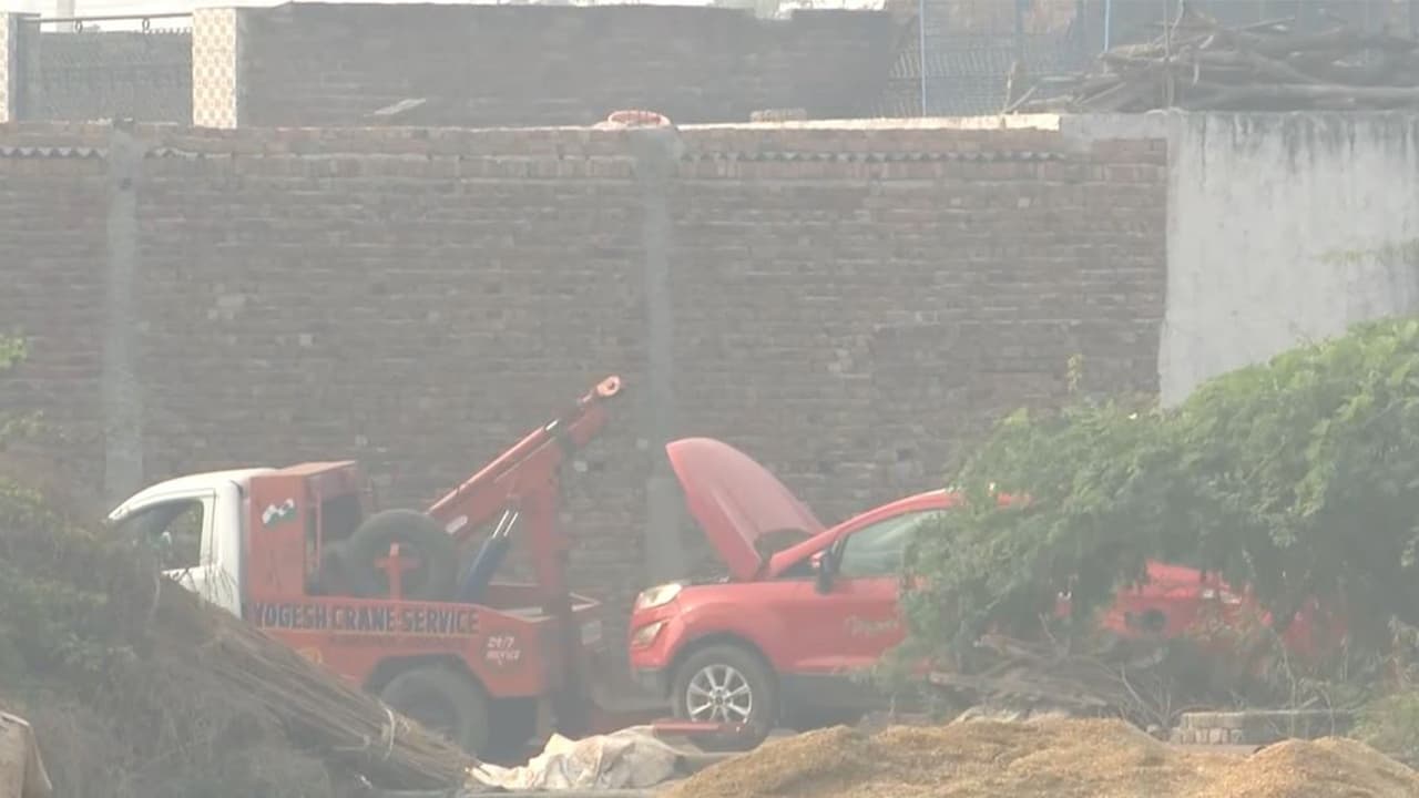 Police teams tow the suspect Ford car away (Photo/ANI)