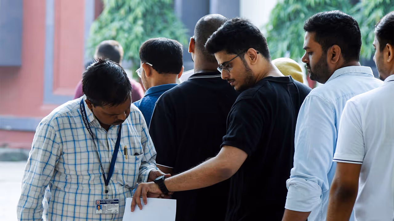 Aspirants queue up for a security check at an examination centre for the UPSC Civil Services (Main) Exam, in Patna (Photo/ANI) Aspirants queue up for a security check at an examination centre for the UPSC Civil Services (Main) Exam, in Patna (Photo/ANI)