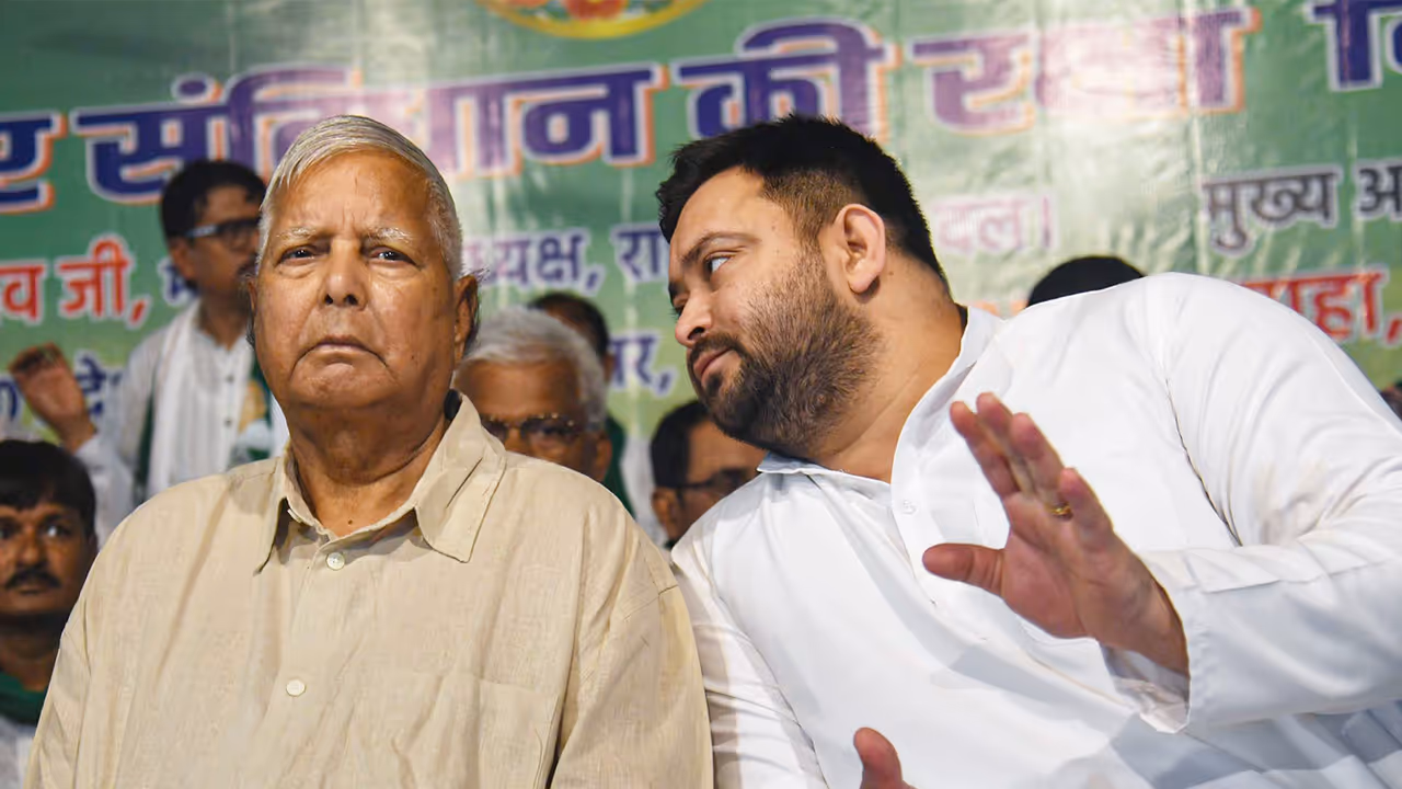 Lalu Prasad Yadav with Tejashwi Yadav (File Photo/ANI)