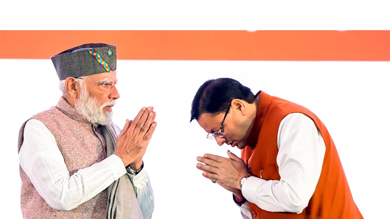 PM Narendra Modi with Uttarakhand CM Pushkar Singh Dhami (Photo/ANI)