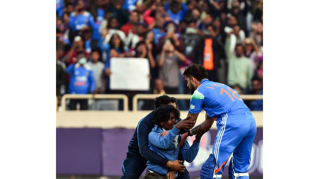 Fan with Virat Kohli after he completed 52nd century. (Photo: ANI)