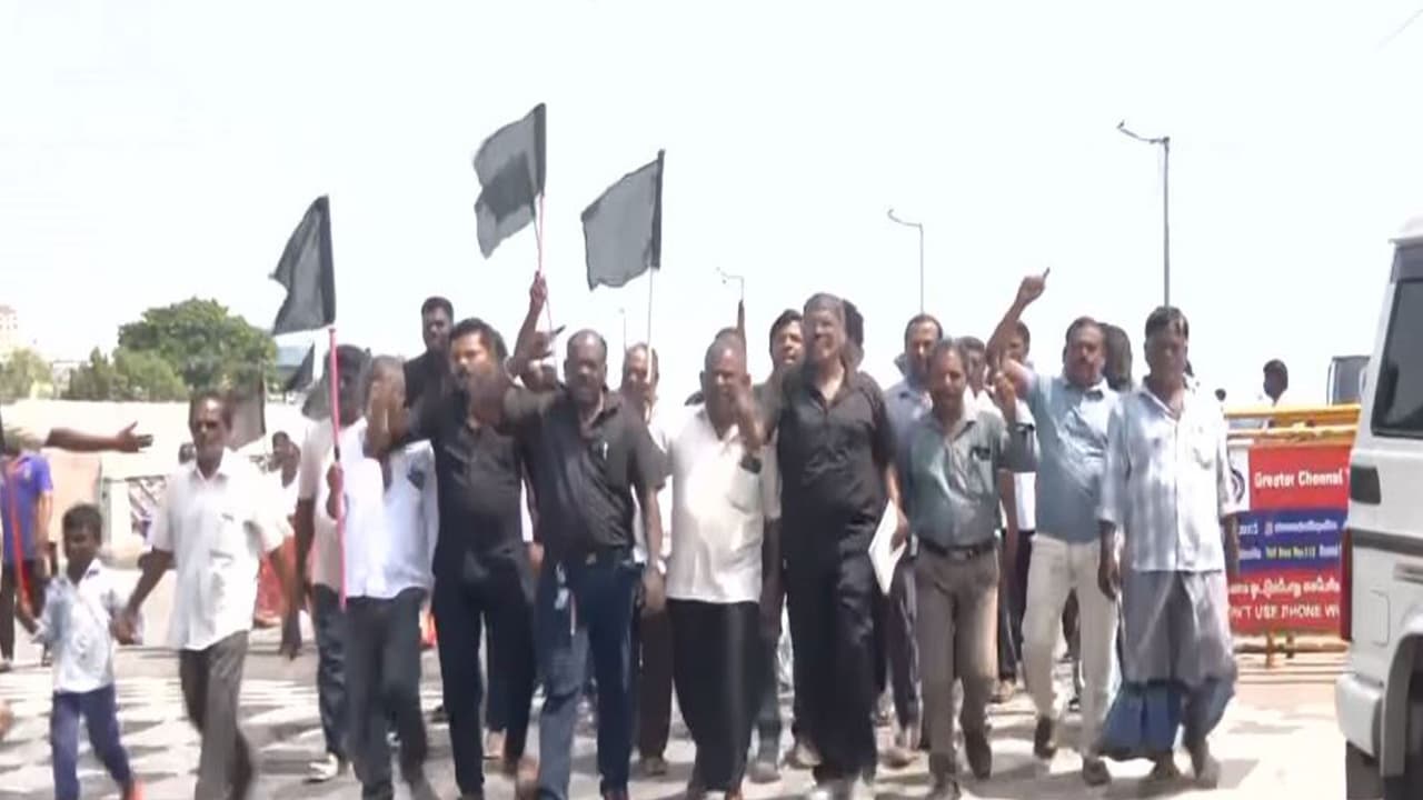 Fishermen raise black flags during protest in Chennai's Pattinapakkam (Photo/ANI) Fishermen raise black flags during protest in Chennai's Pattinapakkam (Photo/ANI)