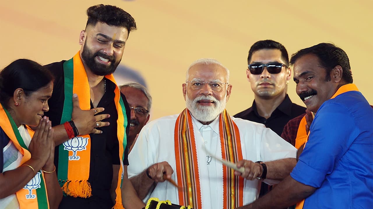 Prime Minister Narendra Modi tries his hand on an iconic drum of Kerala (FilePhoto/ANI) Prime Minister Narendra Modi tries his hand on an iconic drum of Kerala (FilePhoto/ANI)