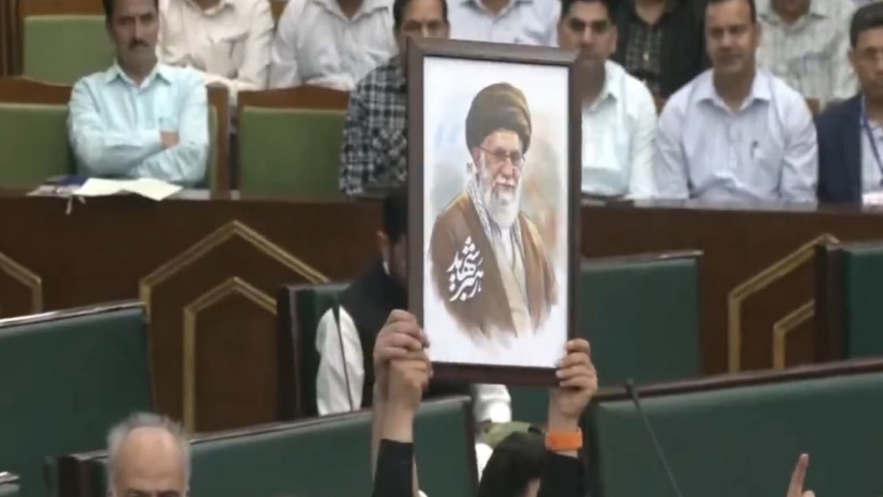 NC MLAs stage a protest and chant slogans inside the J K assembly (Photo/ ANI) NC MLAs stage a protest and chant slogans inside the J K assembly (Photo/ ANI)