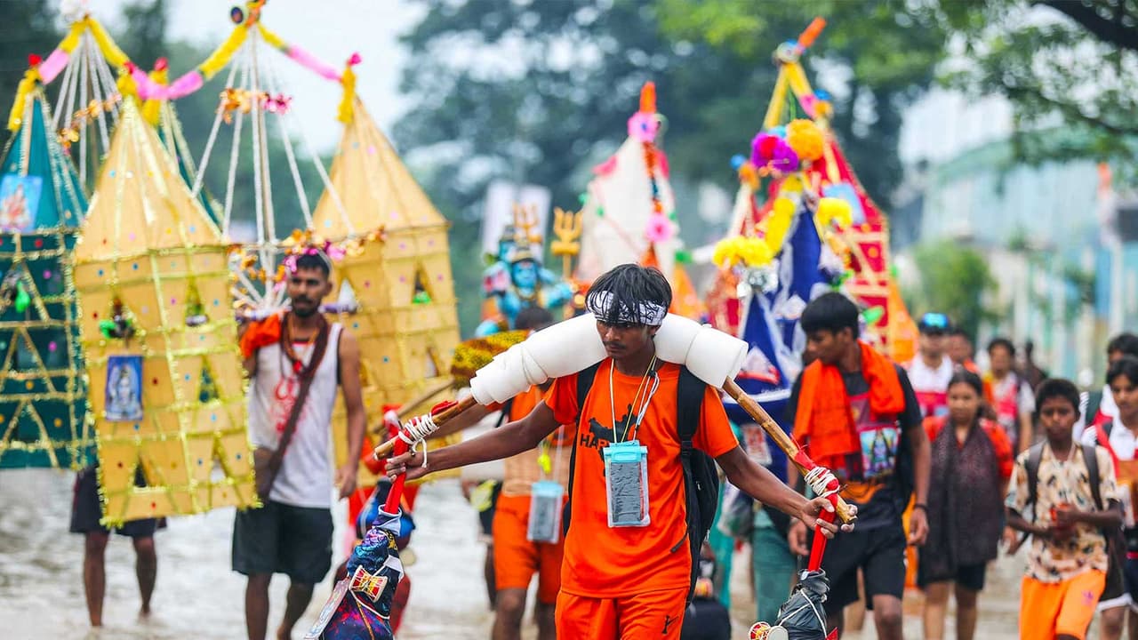 Kanwariyas carrying holy ganga water in decorated kanwars (Photo/ANI) Kanwariyas carrying holy ganga water in decorated kanwars (Photo/ANI)