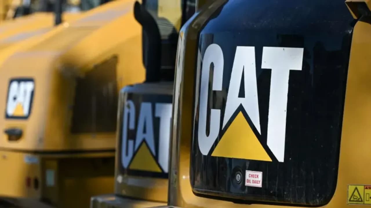 https://stocktwits.com/news articles/markets/equity/caterpillar warns of profit squeeze/chrLvJaRd2k