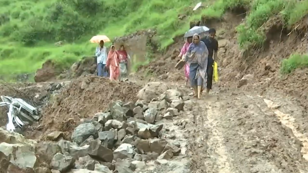 Locals slogging through a mudy road followinf rainfall in Rajouri, Jammu and Kashmir (Photo/ANI) Locals slogging through a mudy road followinf rainfall in Rajouri, Jammu and Kashmir (Photo/ANI)