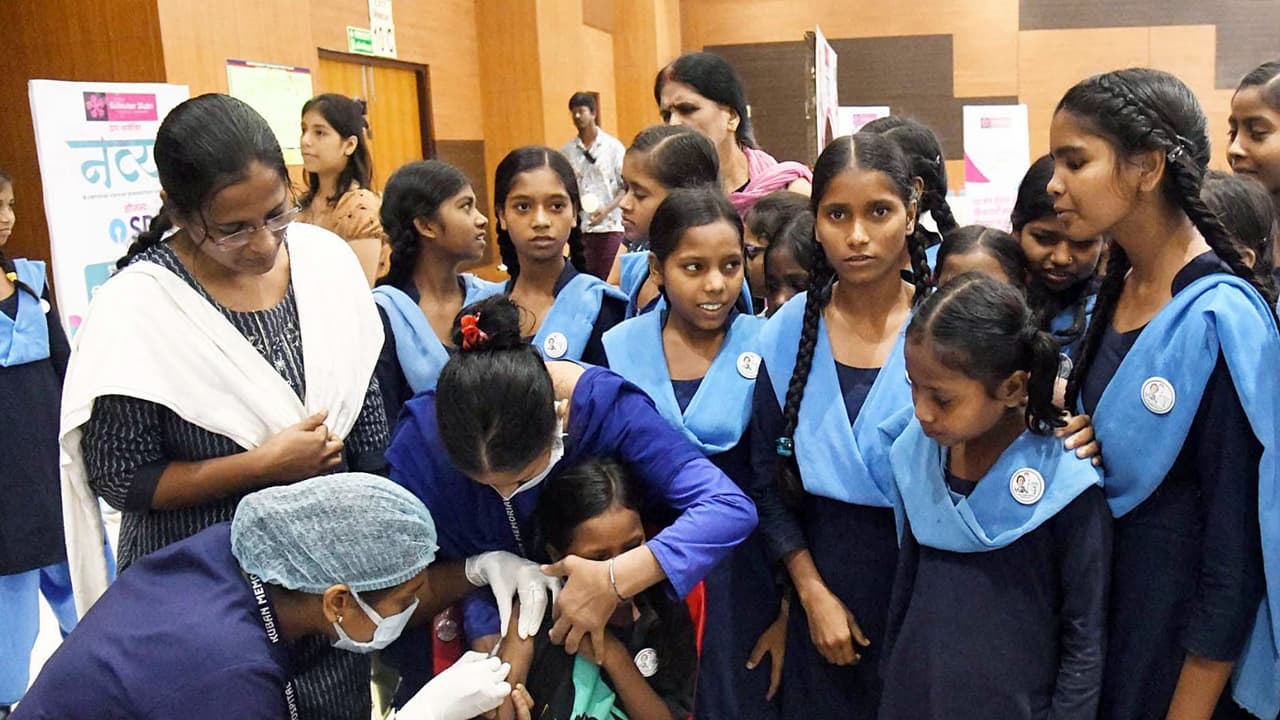A health worker inoculates the HPV vaccines to a school girl during a free HPV vaccination camp (Photo/ANI) A health worker inoculates the HPV vaccines to a school girl during a free HPV vaccination camp (Photo/ANI)