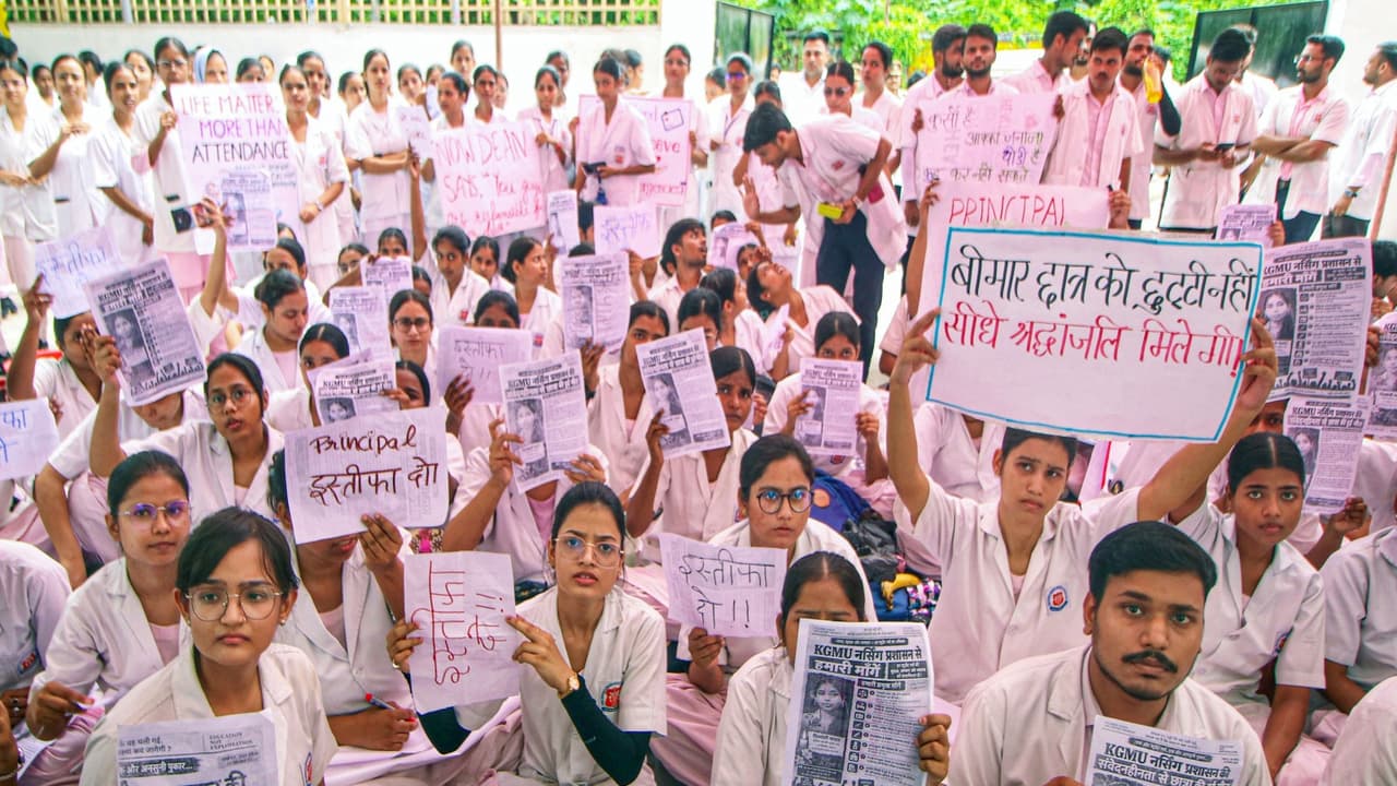 KGMU nursing students and staff stage a protest outside the department following the death of a second year nursing intern (File Photo/ANI) KGMU nursing students and staff stage a protest outside the department following the death of a second year nursing intern (File Photo/ANI)