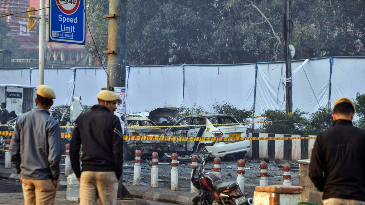 Police personnel stand at the site of the blast in a Hyundai i20 car near Gate no 1 of the Red Fort Metro station (File Photo/ANI) Police personnel stand at the site of the blast in a Hyundai i20 car near Gate no 1 of the Red Fort Metro station (File Photo/ANI)
