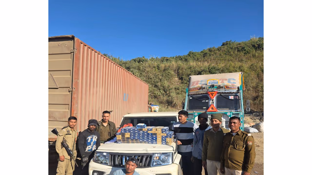 Police with seized cigarettes and heroin in Cachar district. (Photo/ANI) Police with seized cigarettes and heroin in Cachar district. (Photo/ANI)
