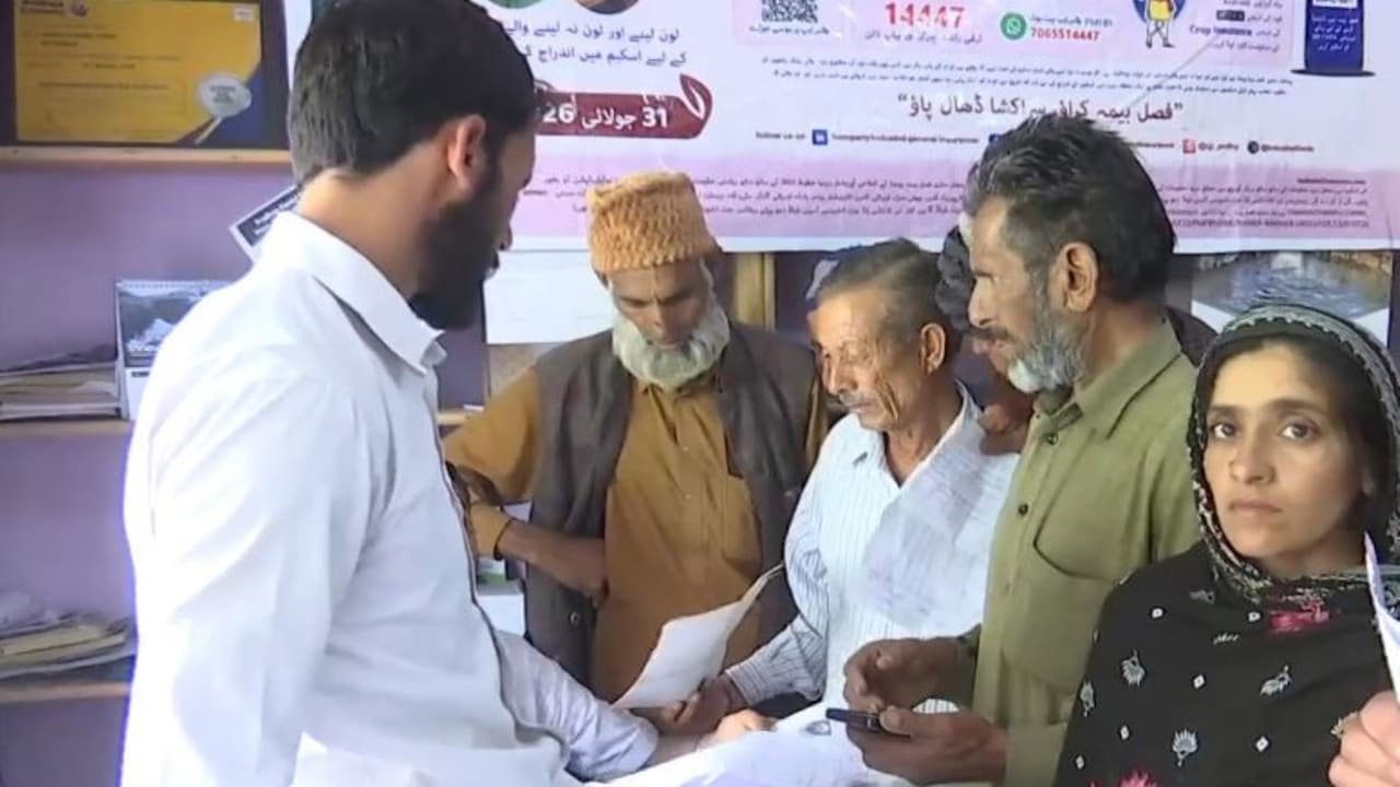 J K: Pradhan Mantri Fasal Bima Yojana awareness campaign reaches farmers in remote, far flung areas of Rajouri (Photo/ANI) J K: Pradhan Mantri Fasal Bima Yojana awareness campaign reaches farmers in remote, far flung areas of Rajouri (Photo/ANI)