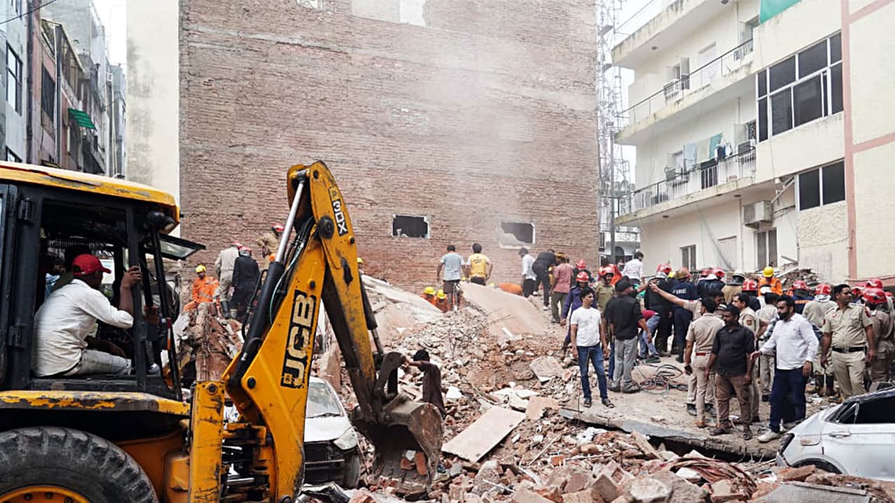 JCB machines carry out rescue operations at the site of a building collapse at Satya Niketan (Photo/ANI) JCB machines carry out rescue operations at the site of a building collapse at Satya Niketan (Photo/ANI)