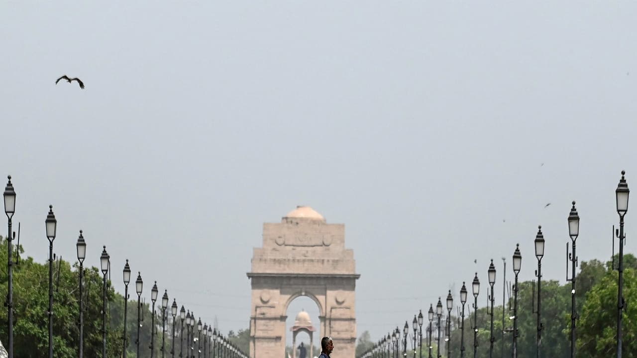 A man walks past the mirages seen at Kartavya Path on a hot summer day, in New Delhi (Photo/ANI) A man walks past the mirages seen at Kartavya Path on a hot summer day, in New Delhi (Photo/ANI)