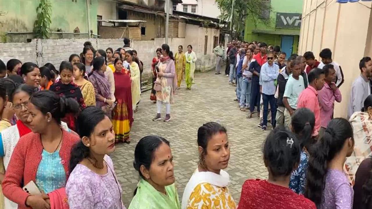 Voters standing in a queue to cast their votes (Photo/ANI) Voters standing in a queue to cast their votes (Photo/ANI)