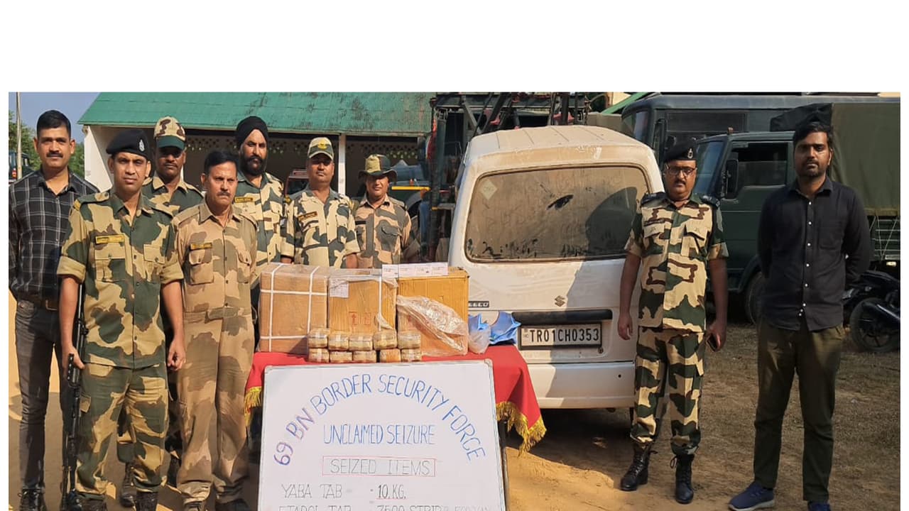 BSF officers displaying the seized drugs and vehicle during an operation in Tripura (Photo/BSF HQ) BSF officers displaying the seized drugs and vehicle during an operation in Tripura (Photo/BSF HQ)