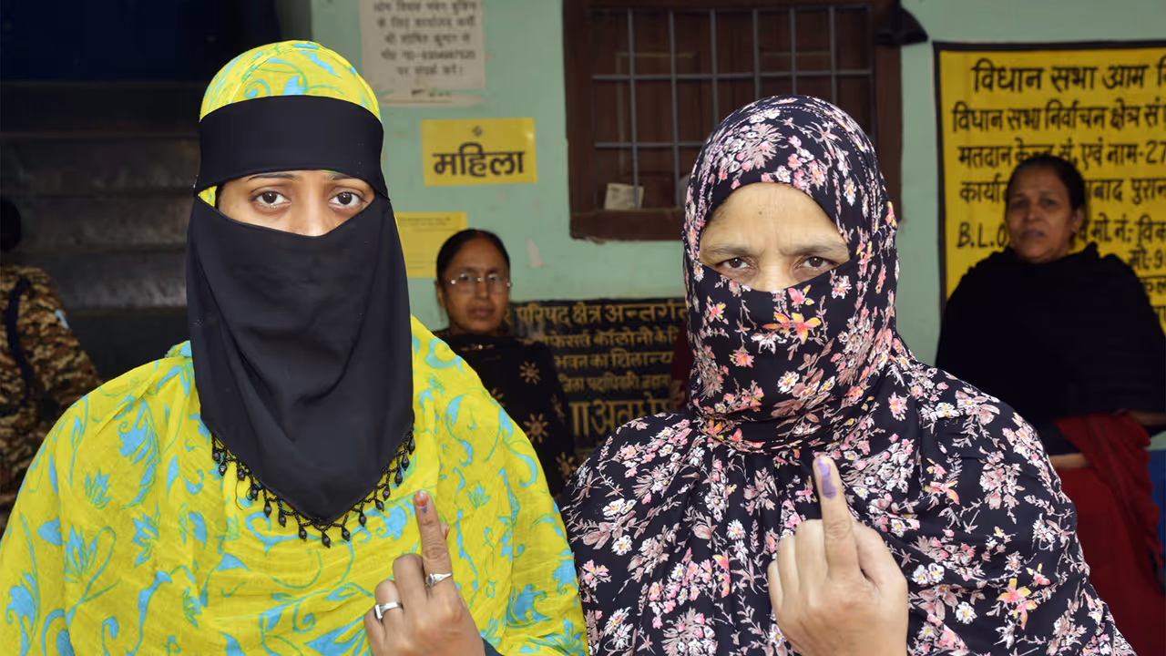 Women voters showing their fingers marked with indelible ink (Photo/ANI)