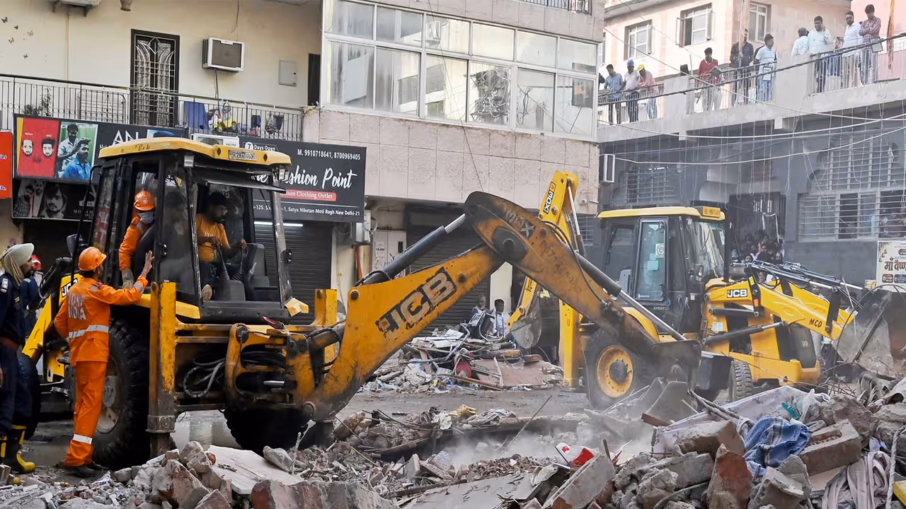 Rescue operations underway at the site of a building collapse near Satya Niketan (Photo/ANI) Rescue operations underway at the site of a building collapse near Satya Niketan (Photo/ANI)