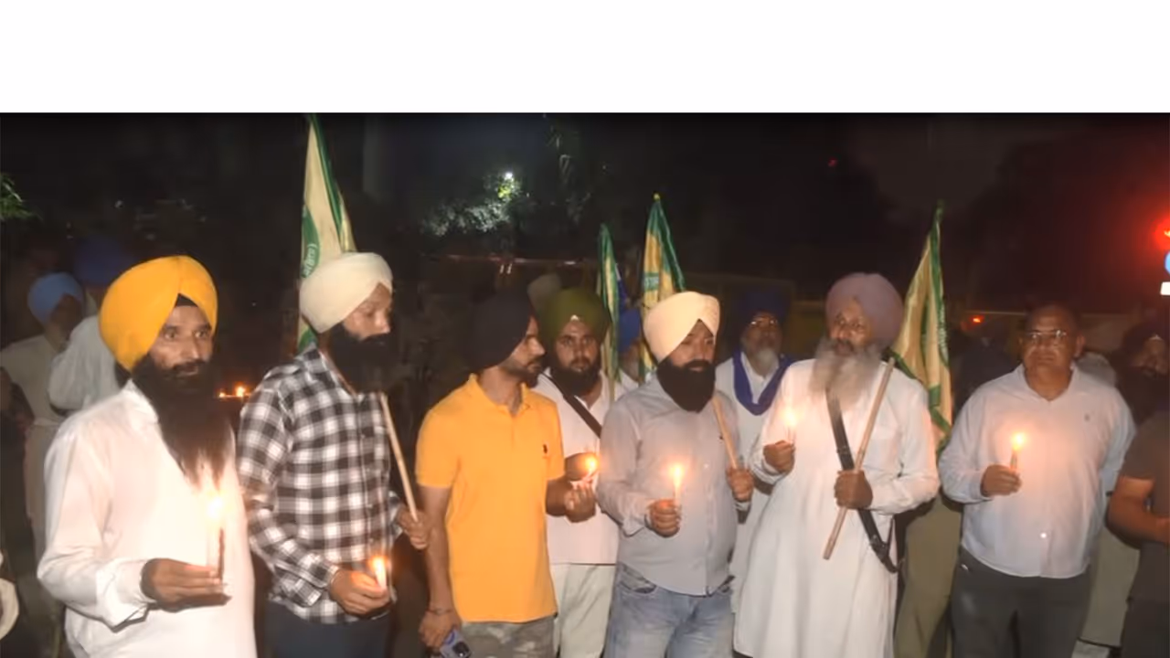 SKM, Kisan Mazdoor Morcha hold candle march to mark 2021 Lakhimpur Kheri incident anniversary (Photo/ANI) SKM, Kisan Mazdoor Morcha hold candle march to mark 2021 Lakhimpur Kheri incident anniversary (Photo/ANI)