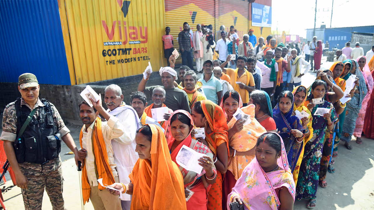 Voters wait in queues to cast their votes in Patna (Photo/ANI) Voters wait in queues to cast their votes in Patna (Photo/ANI)