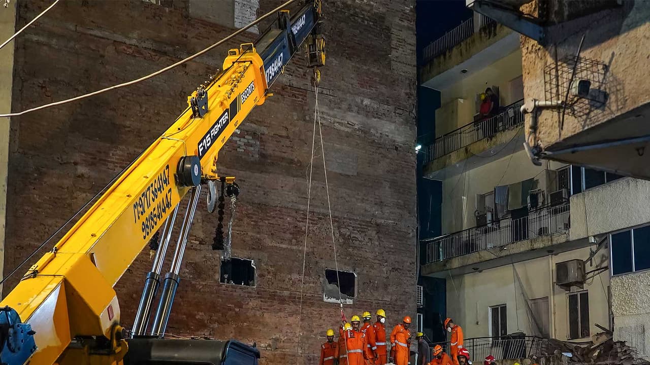 Rescue operations underway at the Satya Niketan building collapse site (Photo/ANI) Rescue operations underway at the Satya Niketan building collapse site (Photo/ANI)