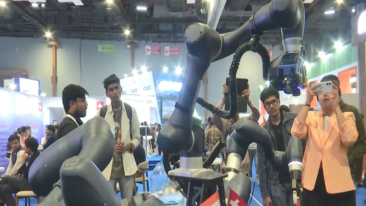 CyRo, the stationary robot developed by CynLr, demonstrates intuitive object handling at the AI Impact Summit pavilion in New Delhi. (Photo/ANI) CyRo, the stationary robot developed by CynLr, demonstrates intuitive object handling at the AI Impact Summit pavilion in New Delhi. (Photo/ANI)