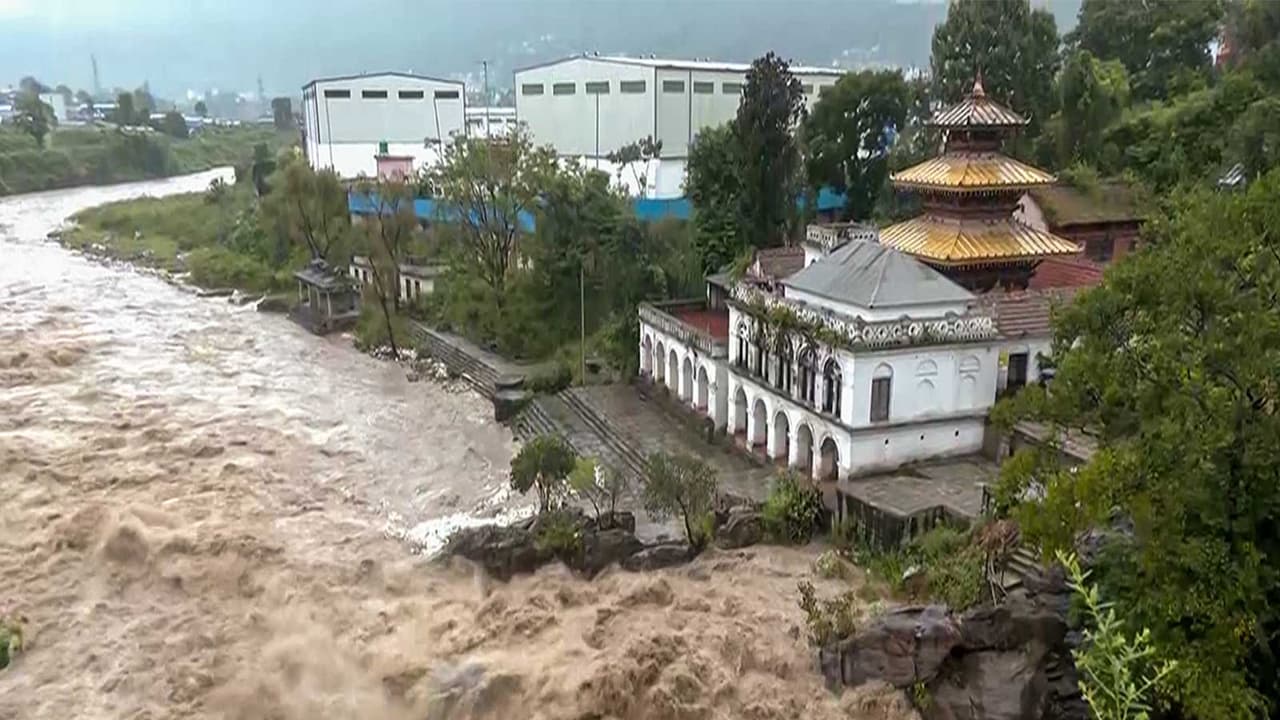 Swollen Bagmati River overflows banks in Kathmandu after heavy rain (Photo/ANI) Swollen Bagmati River overflows banks in Kathmandu after heavy rain (Photo/ANI)