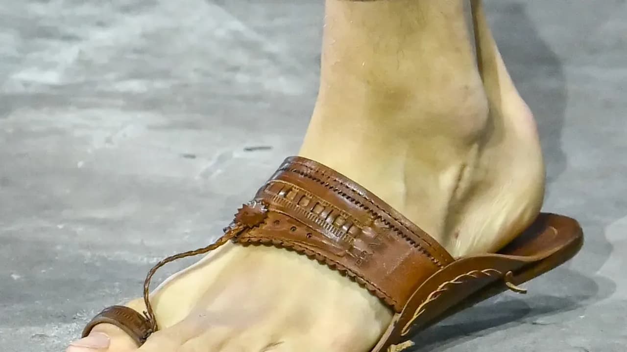 https://stocktwits.com/news articles/markets/equity/prada credits centuries old indian kolhapuri craftsmanship behind open toe sandals design unveiled at milan show/chmZe7GRReZ