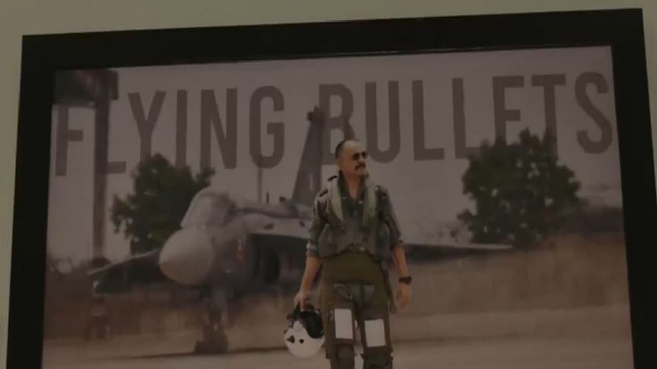 Wing Commander Naman Syal's photo in a frame at his native village Patiyalkar in Kangra (Photo/ANI)