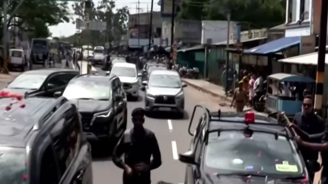Man rushes todwards CM VIjay's vehicle in Karur (Photo/ANI) Man rushes todwards CM VIjay's vehicle in Karur (Photo/ANI)