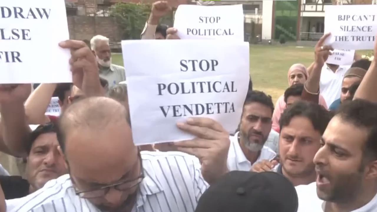 J K Congress party workers protest against the FIR registered in Uttarakhand against Rahul Gandhi (Photo:ANI) J K Congress party workers protest against the FIR registered in Uttarakhand against Rahul Gandhi (Photo:ANI)
