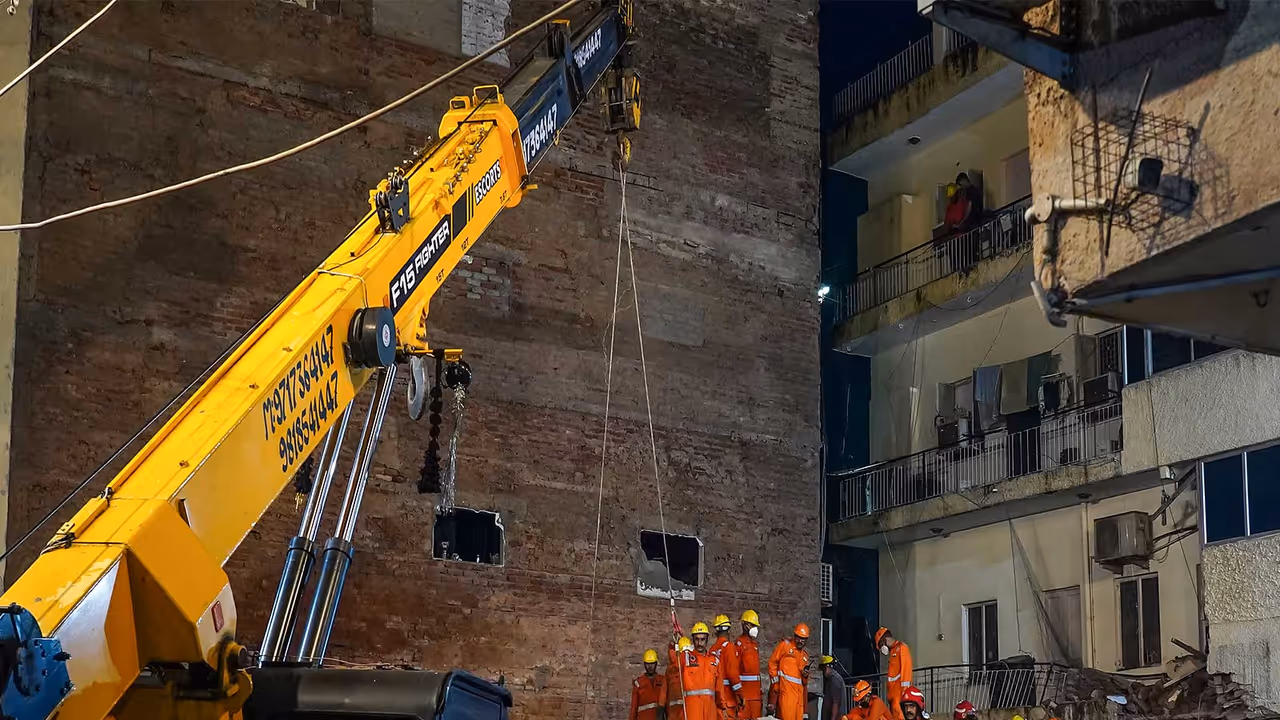 Rescue operations underway at the Satya Niketan building collapse site (Photo/ANI) Rescue operations underway at the Satya Niketan building collapse site (Photo/ANI)